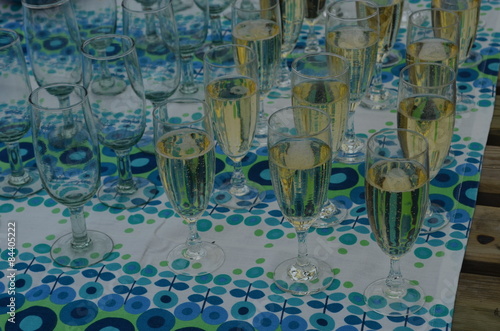 Glasses with champaign on blue tablecloth
