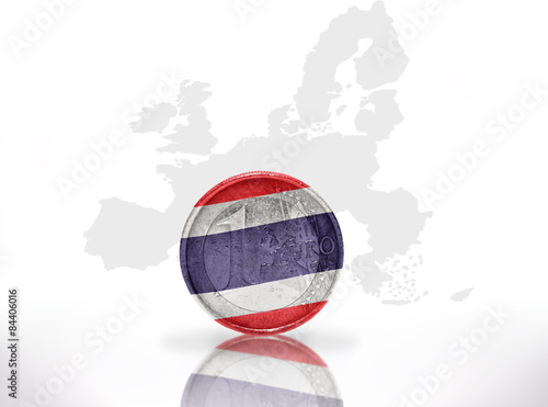 euro coin with thailand flag on the european union map background