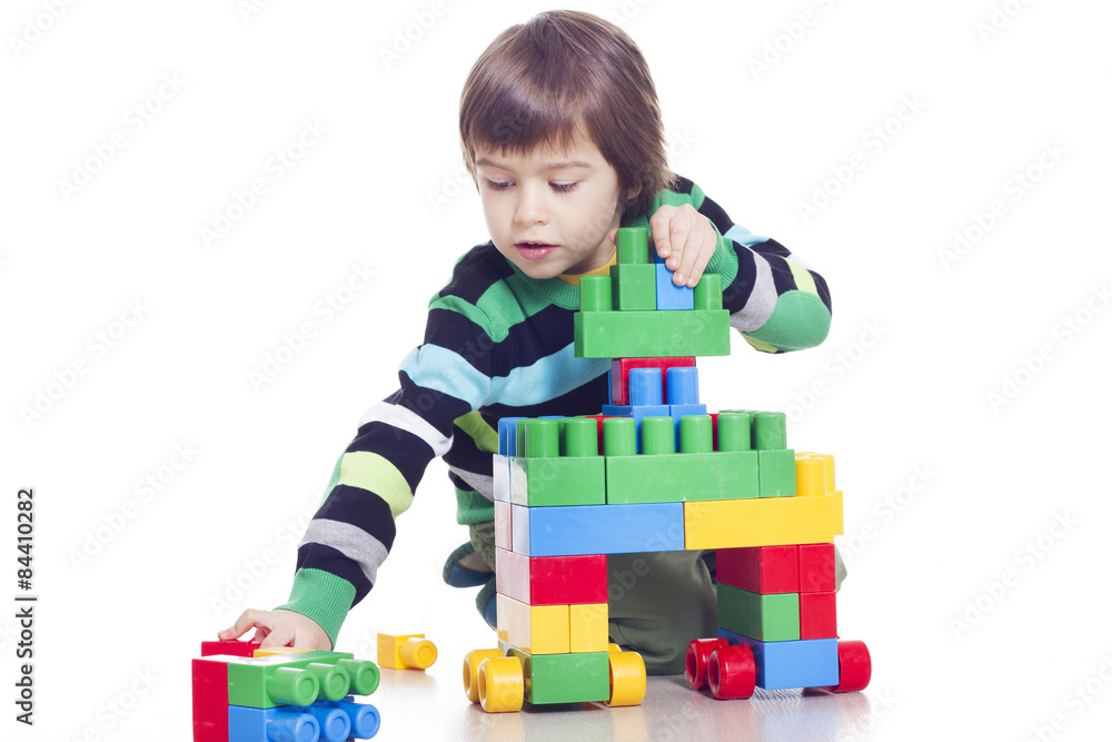 Little boy playing Bricks