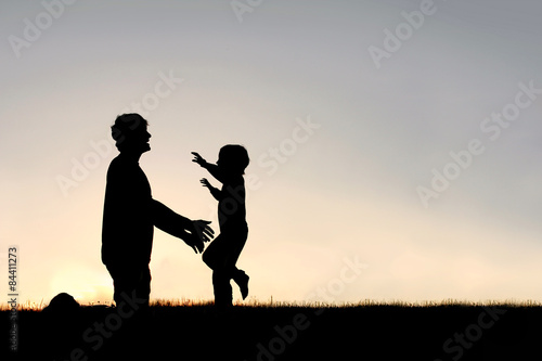 Happy Young Child Running to Greet Dad Silhouette