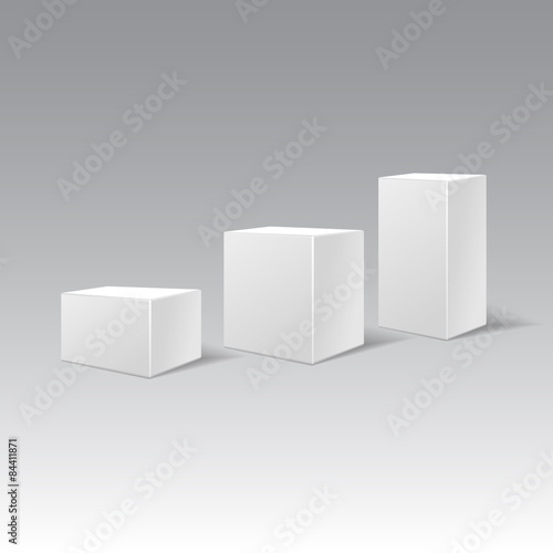 Three white cardboard gift rectangular boxes different height.