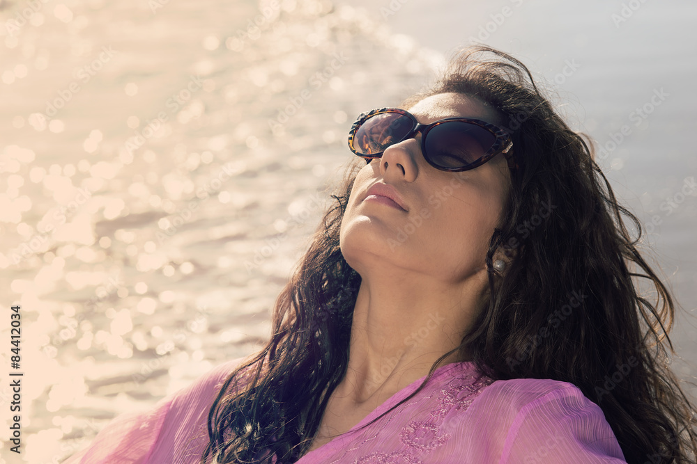 beautiful girl take a sunbathing on the seashore warm filter beautiful girl take a sunbathing on the seashore warm filter