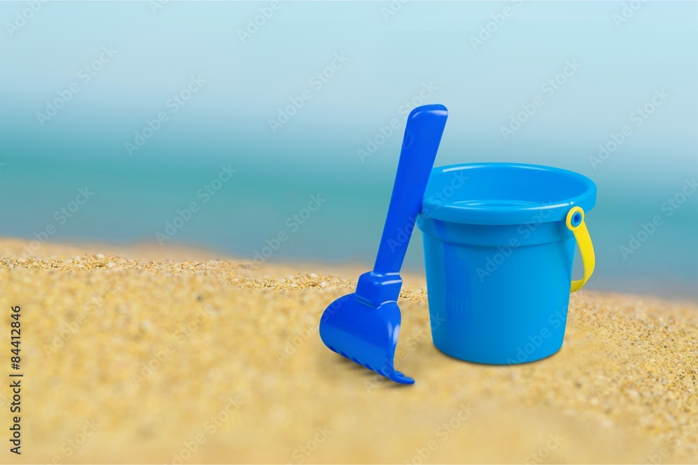 Bucket, spade, sand.