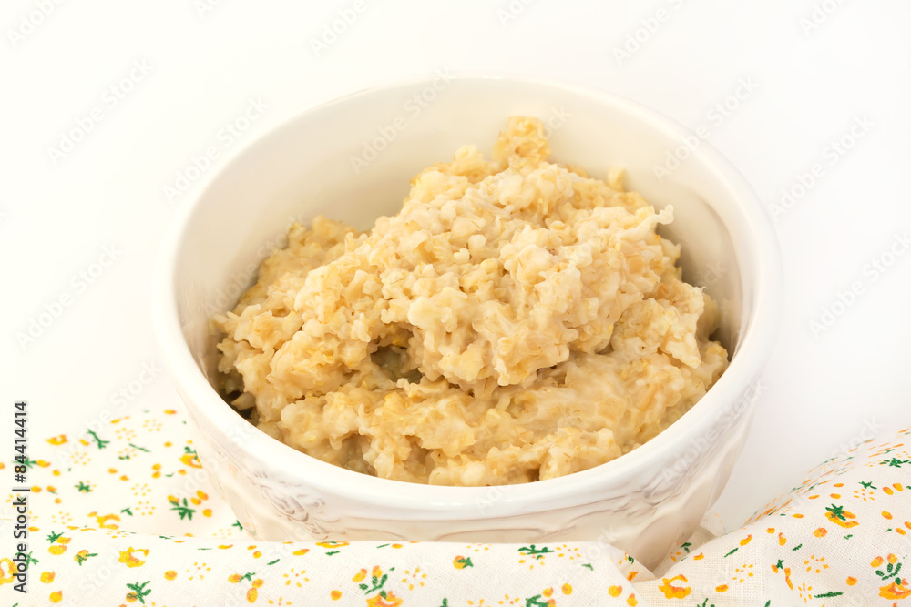 breakfast oatmeal in a white ceramic bowl shabby chic vintage retro selective soft focus breakfast oatmeal in a white ceramic bowl shabby chic vintage retro selective soft focus