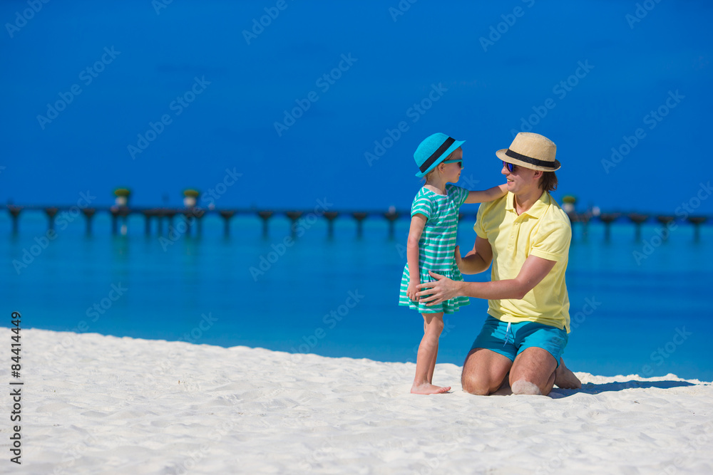 Little girl and young father during tropical beach vacation Little girl and young father during tropical beach vacation