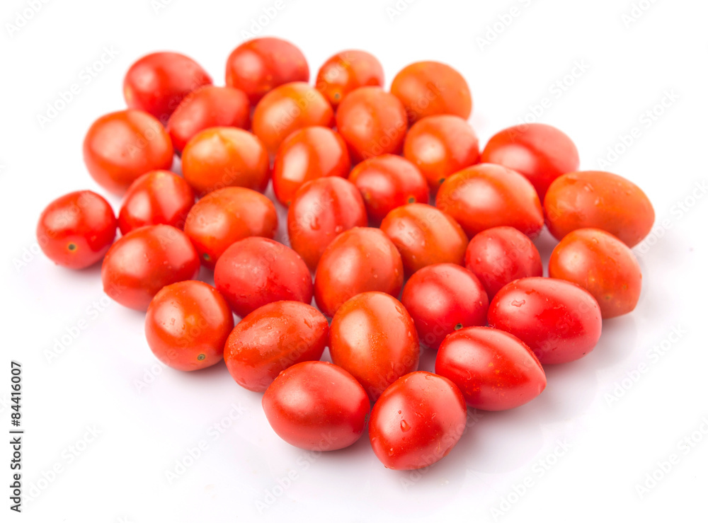 Bite sized red cherry grape tomato over white background Bite sized red cherry grape tomato over white background