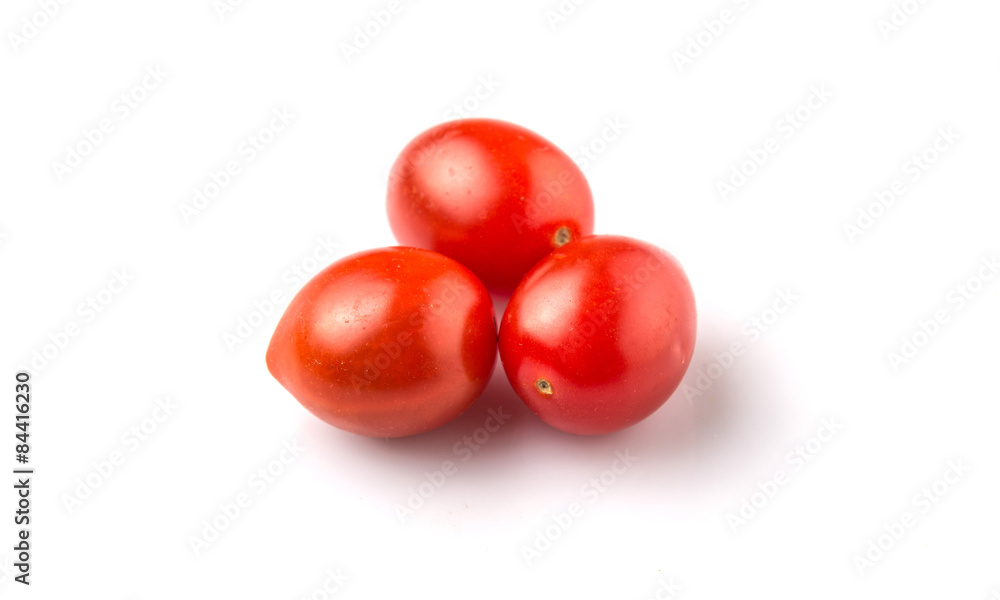 Bite sized red cherry grape tomato over white background Bite sized red cherry grape tomato over white background