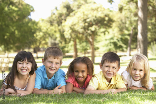 Group Of Children Laying In Park
