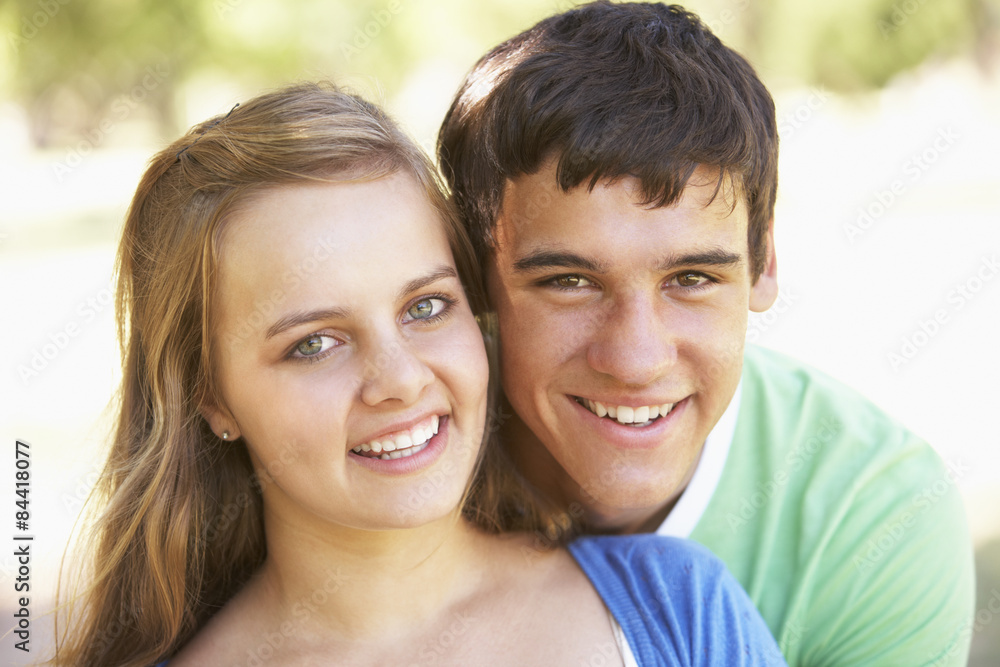 Teenage Couple Having Fun In Park Together Teenage Couple Having Fun In Park Together