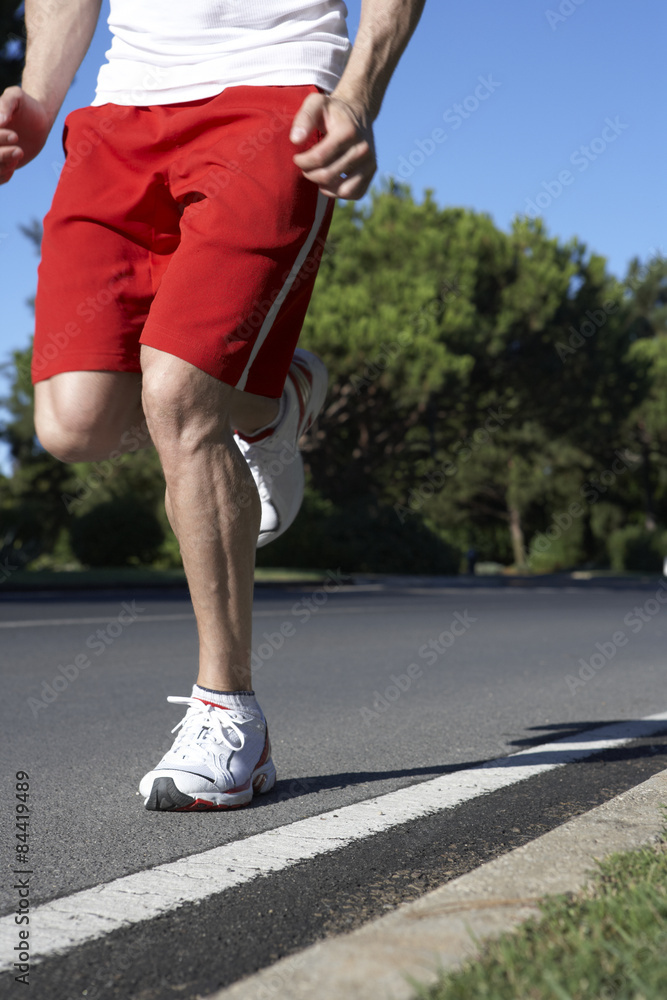 Close Up Of Man Running On Road