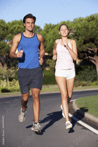Young Couple Running On Road © Monkey Business