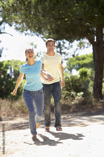 Young Couple On Romantic Walk In Countryside