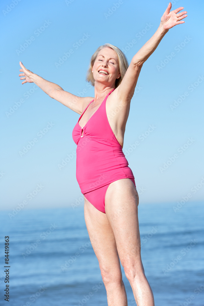 Senior Woman Standing On Summer Beach Senior Woman Standing On Summer Beach