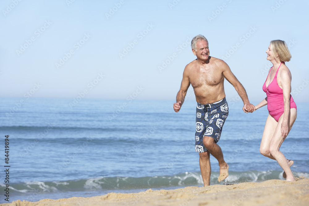 Senior Couple Enjoying Beach Holiday Senior Couple Enjoying Beach Holiday