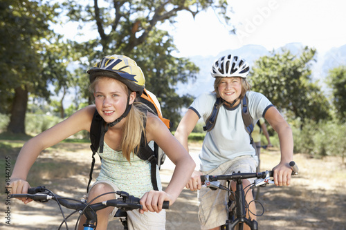 Teenage Couple Cycling Through Countryside