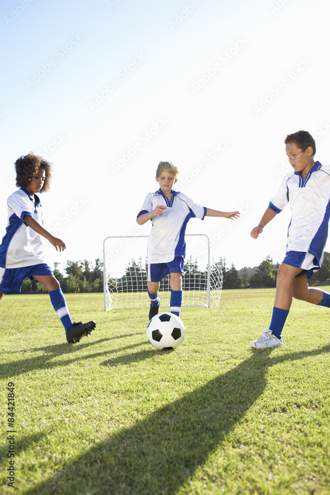 Obraz premium Group Of Boys Playing Football