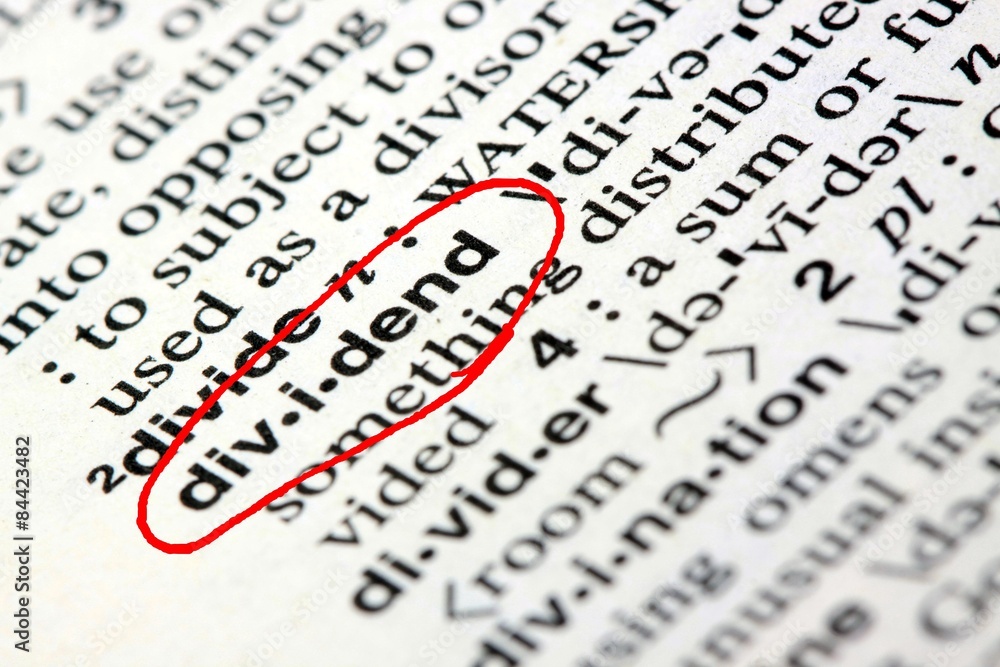 Fototapeta premium Closeup of the word dividend in the English dictionary