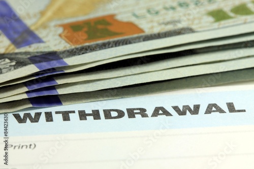 Withdrawal slip from bank checking or savings account - Finance and accounting concept