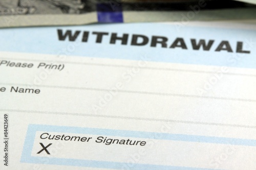 Withdrawal slip from bank checking or savings account - Finance and accounting concept