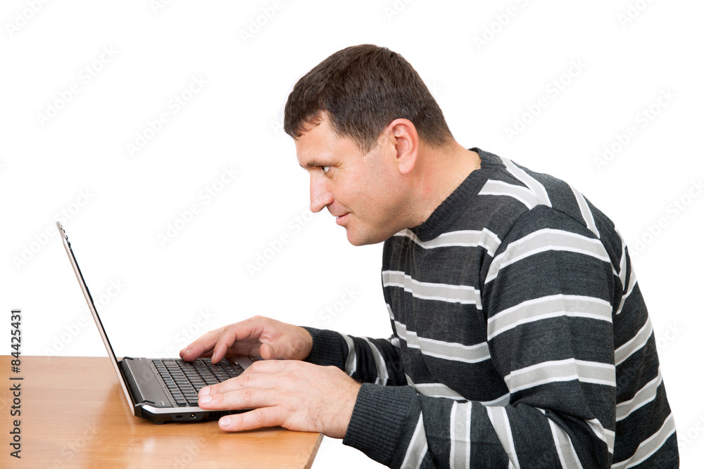 the man looks at the laptop screen, isolated on white background the man looks at the laptop screen, isolated on white background