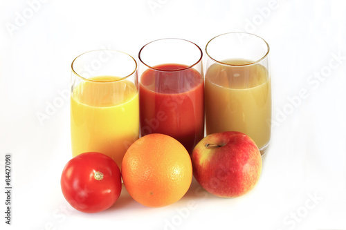Three glasses with juice,tomato, orange, apple
