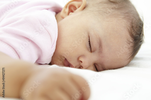 Close Up Of Sleeping Baby Girl At Home