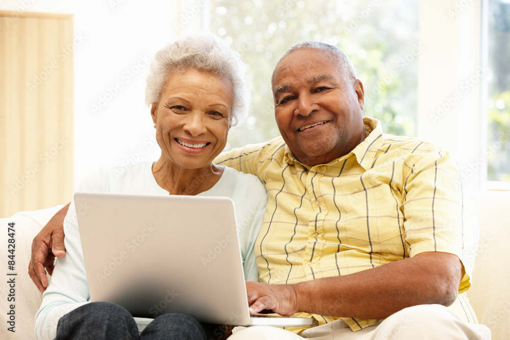 Senior African American couple using laptop Stock Photo | Adobe Stock