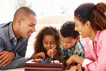 Mixed race family playing solitaire