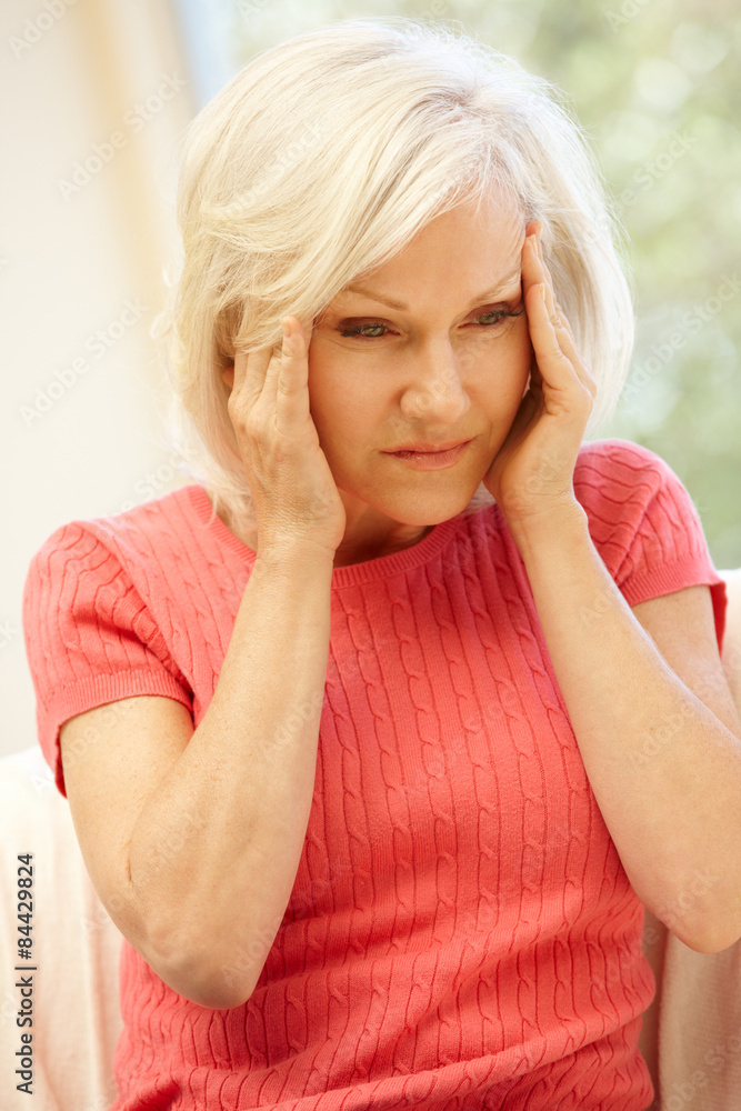 Mid age woman with headache Mid age woman with headache