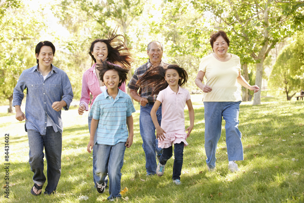 Multi-generation Asian family running in park Multi-generation Asian family running in park