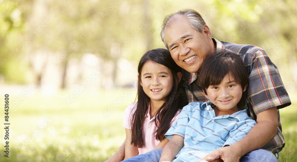 Portrait Asian grandfather and grandchildren in park Portrait Asian grandfather and grandchildren in park