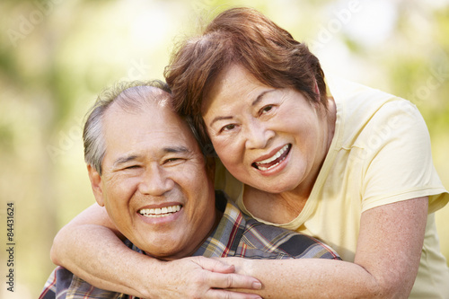 Portrait romantic senior Asian couple outdoors