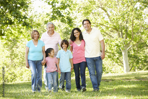 Multi Generation Hispanic Family Walking In Park © Monkey Business