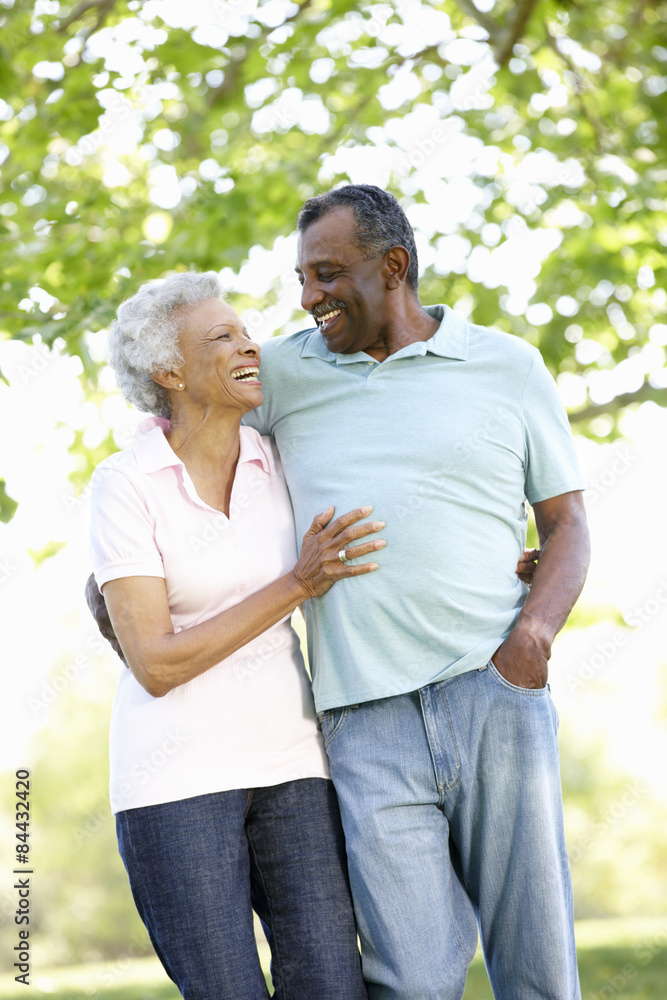 Romantic Senior African American Couple Walking In Park Romantic Senior African American Couple Walking In Park