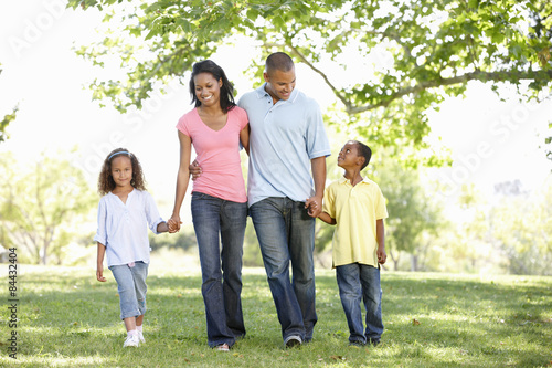 Young African American Family Enjoying Walk In Park © Monkey Business