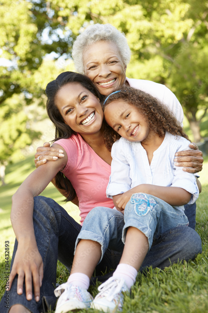African American Grandmother, Mother And Daughter Relaxing In Park African American Grandmother, Mother And Daughter Relaxing In Park