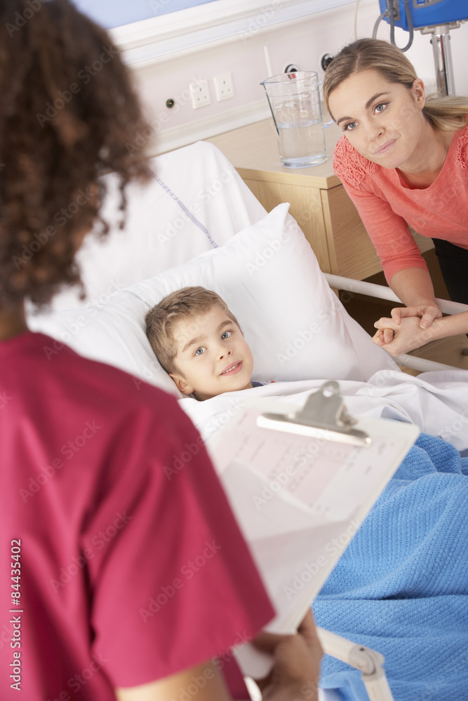 Nurse in hospital with sick boy and mother Nurse in hospital with sick boy and mother