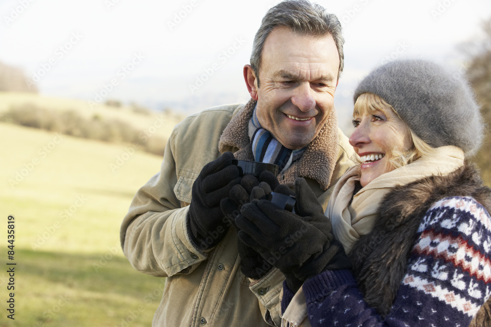Fototapeta premium Mature couple on country picnic in winter