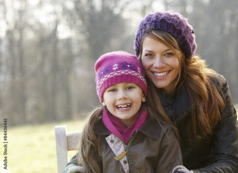 Obraz premium Portrait mother and daughter outdoors in winter