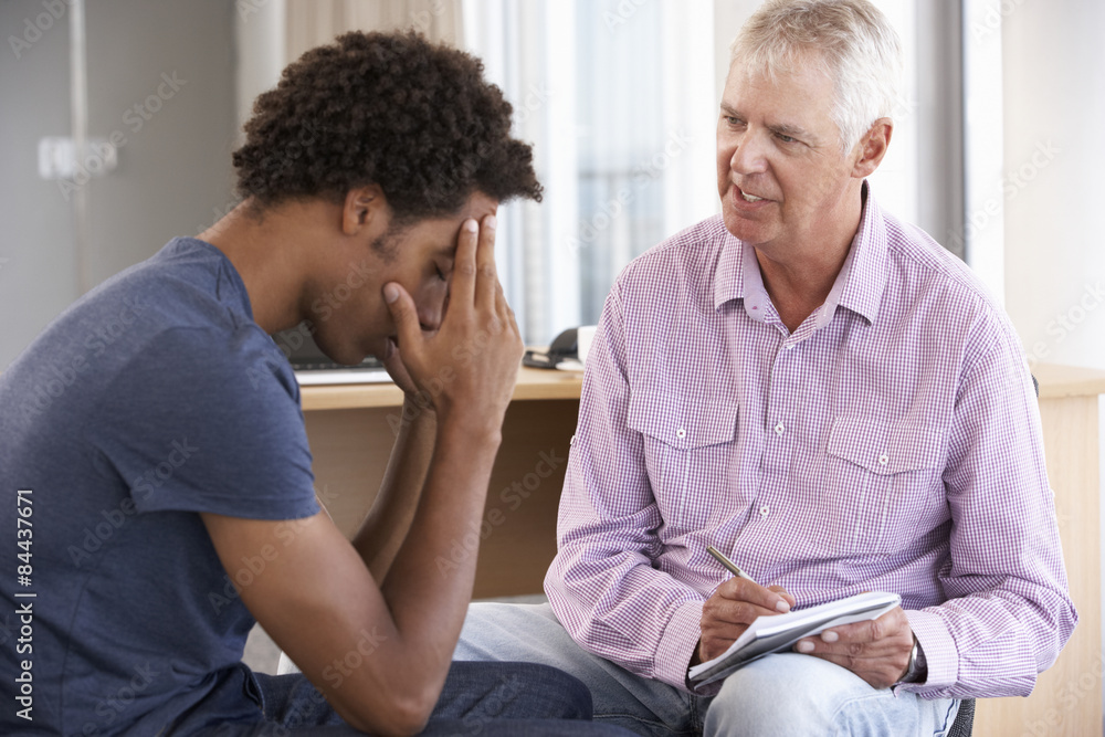Fototapeta premium Young Man Having Counselling Session