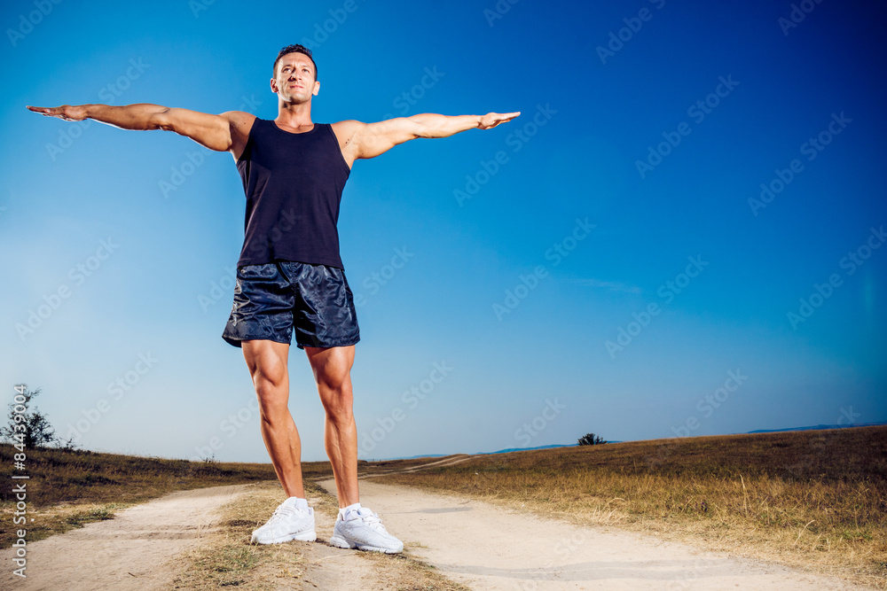 Athlete outside in nature on a dusty road Athlete outside in nature on a dusty road