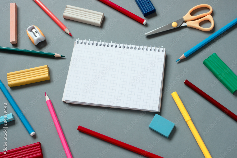 Colorful School Supplies Scattered Around Notebook Colorful School Supplies Scattered Around Notebook