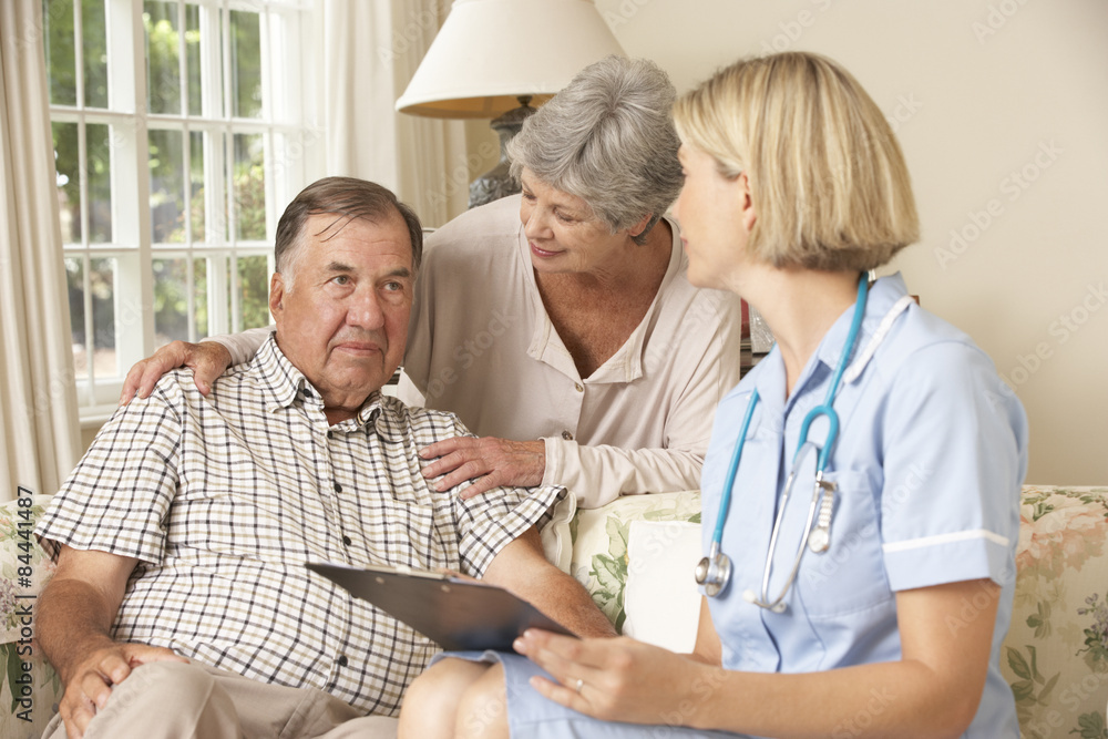 Retired Senior Man Having Health Check With Nurse At Home Retired Senior Man Having Health Check With Nurse At Home