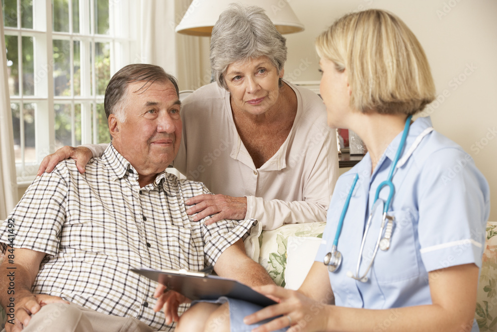 Retired Senior Man Having Health Check With Nurse At Home Retired Senior Man Having Health Check With Nurse At Home