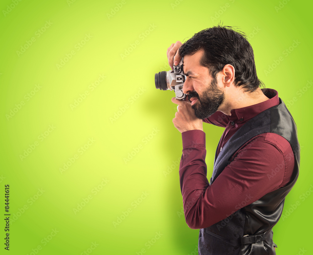 Man wearing waistcoat photographing Man wearing waistcoat photographing