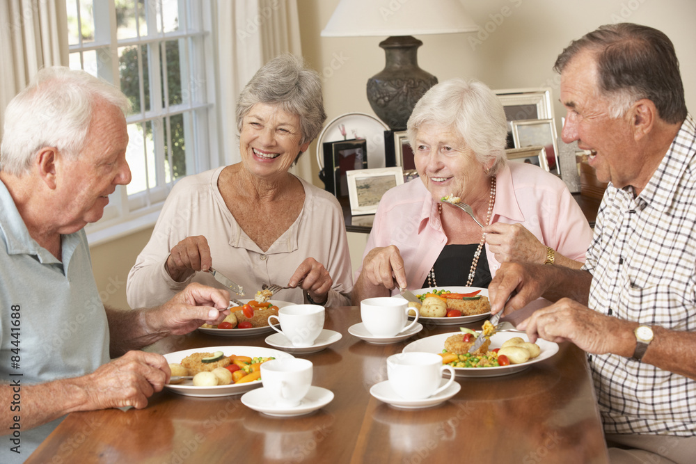 Group Of Senior Couples Enjoying Meal Together Group Of Senior Couples Enjoying Meal Together