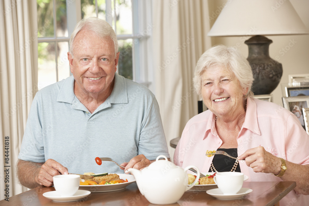 Senior Couple Enjoying Meal Together At Home Senior Couple Enjoying Meal Together At Home
