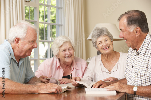 Group Of Senior Couples Attending Book Reading Group photo