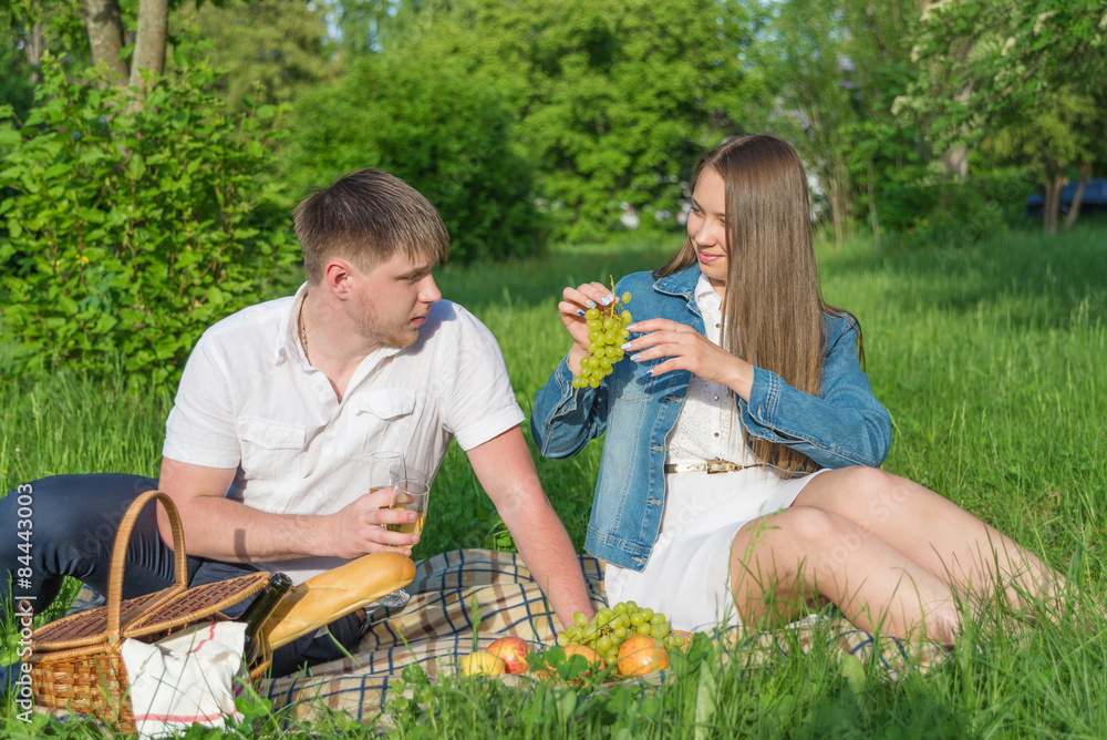Young couple at a picnic in a city park Young couple at a picnic in a city park