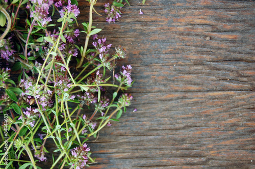 background of fresh thyme on wooden table